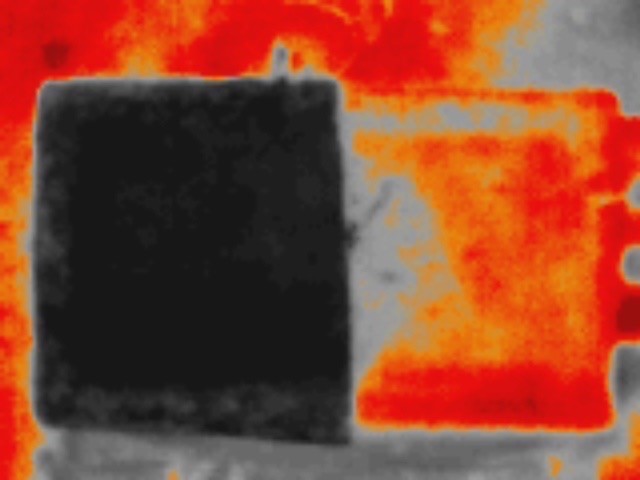 Thermal image of coated (left side) vs uncoated (right side) roof